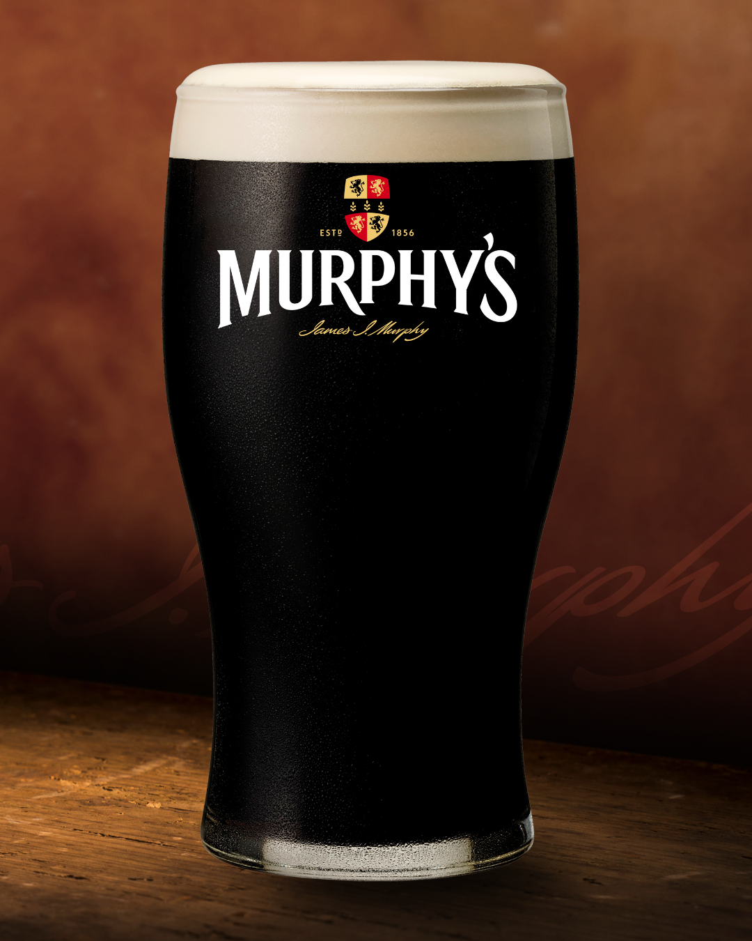 Murphy's Pint Glass On Wooden Bar Murphy's Pint Glass On Wooden Bar